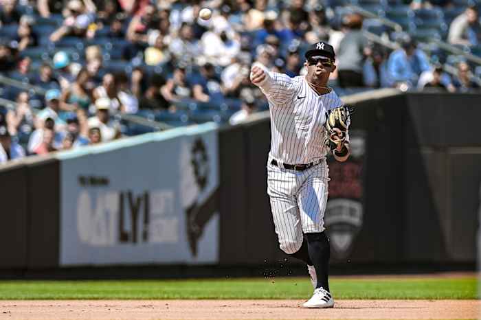 Jul 23, 2023; Bronx, New York, USA; New York Yankees third baseman Oswald Peraza (91) fields a ground ball and throws to first base for an out against the Kansas City Royals during the fourth inning at Yankee Stadium.